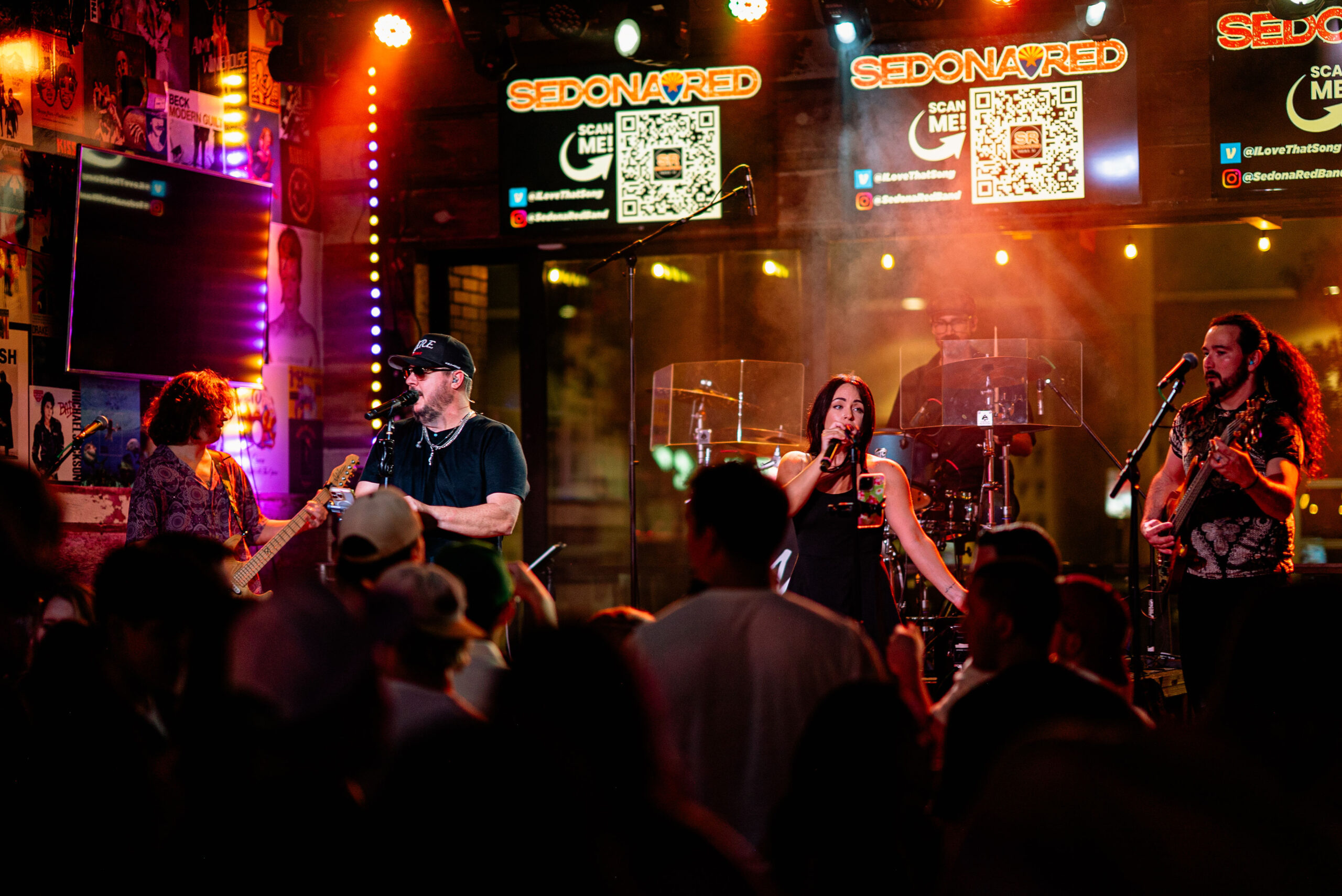 Sedona Red performing live under colorful stage lights